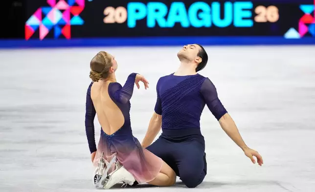 Minerva Fabienne Hase and Nikita Volodin of Germany perform during the pairs free skating at the Figure Skating World Championships in Prague, Czech Republic, Thursday, March 26, 2026. (AP Photo/Petr David Josek)
