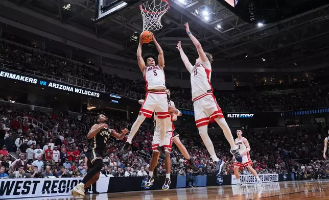 Arizona guard Brayden Burries (5) grabs a rebound during the second half in the Elite Eight of the NCAA college basketball tournament against Purdue, Saturday, March 28, 2026, in San Jose, Calif. (AP Photo/Godofredo A. Vásquez)