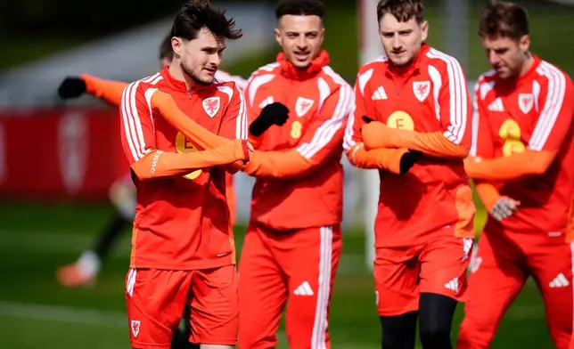 Wales' Liam Cullen, left, during a training session, in Hensol, England, Wednesday March 25, 2026. (Nick Potts/PA via AP)