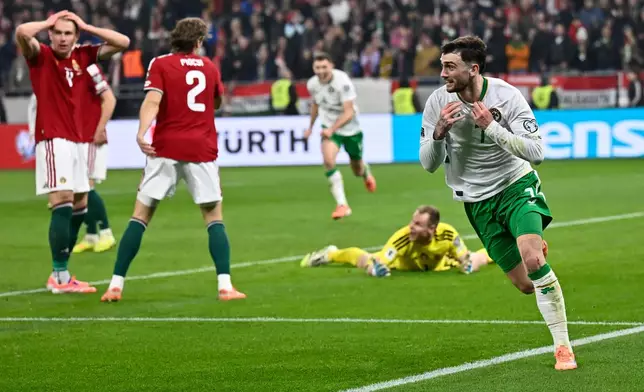 FILE - Ireland's Troy Parrott, right, celebrates after scoring his side's third goal during the World Cup 2026 group F qualifying soccer match between Hungary and Ireland in Budapest, Hungary, Nov. 16, 2025. (AP Photo/Denes Erdos, File)