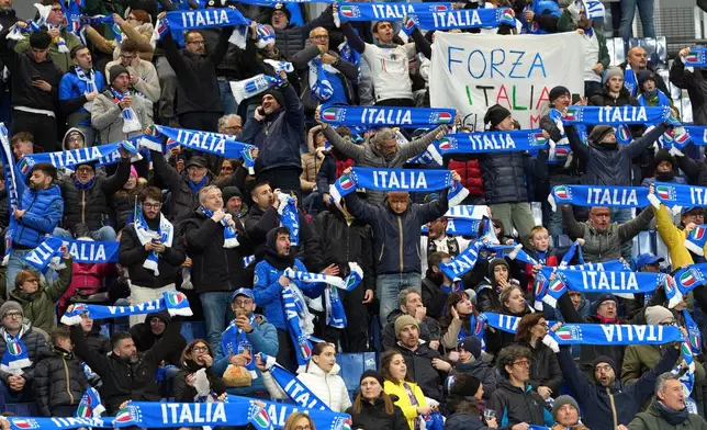 Italian fans wait for the start of the World Cup qualifying play-off soccer match between Italy and Northern Ireland, in Bergamo, Italy, Thursday, March 26, 2026. (AP Photo/Antonio Calanni)