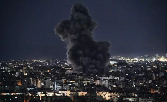 Smoke rises from Israeli airstrikes in Dahiyeh, a southern suburb of Beirut, Lebanon, early Tuesday, March 3, 2026. (AP Photo/Bilal Hussein)