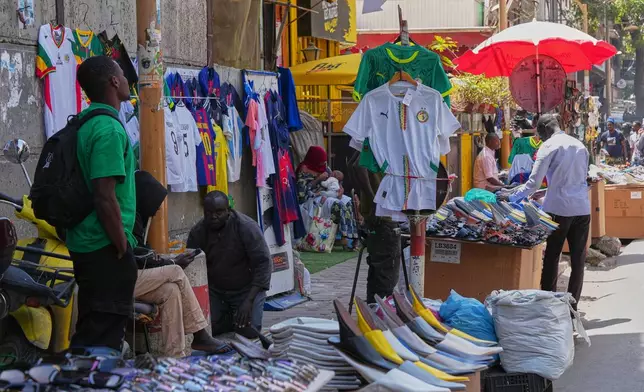 A roadside shop displays Senegal national team shirts in Dakar, Senegal, Wednesday, March 18, 2026. (AP Photo/Misper Apawu)