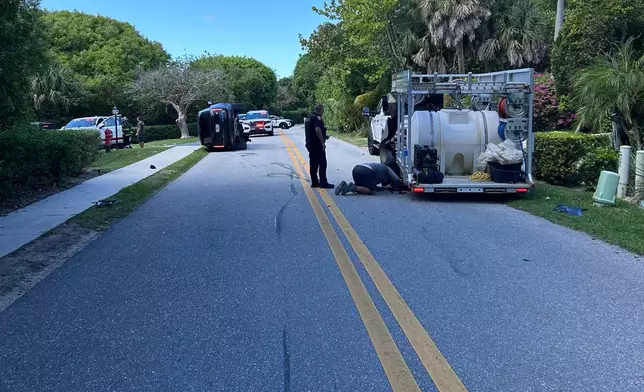 This photo provided by the Martin County Sheriff's Office shows skid marks near the overturned vehicle in a rollover crash which involved Tiger Woods in Jupiter Island, Fla., on Friday, March 27, 2026. (Martin County Sheriff's Office via AP)