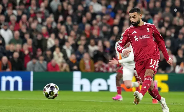 Liverpool's Mohamed Salah takes and misses a penalty during the second leg of the Champions League round of 16 soccer match between Liverpool and Galatasaray, in Liverpool, England, Wednesday, March 18, 2026. (AP Photo/Jon Super)