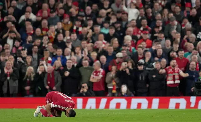 Liverpool's Mohamed Salah celebrates after scoring his side's fourth goal during the second leg of the Champions League round of 16 soccer match between Liverpool and Galatasaray, in Liverpool, England, Wednesday, March 18, 2026. (AP Photo/Jon Super)