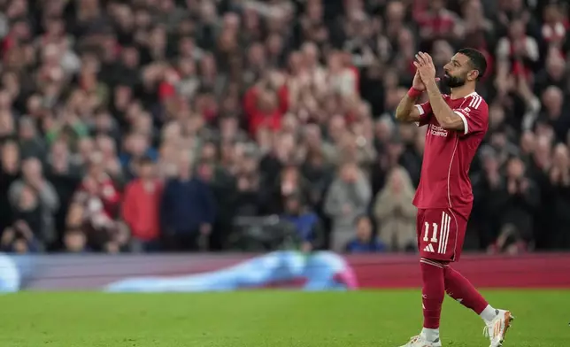 Liverpool's Mohamed Salah leaves the field after substitution during the second leg of the Champions League round of 16 soccer match between Liverpool and Galatasaray, in Liverpool, England, Wednesday, March 18, 2026. (AP Photo/Jon Super)