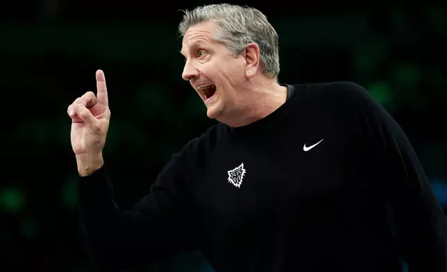 Minnesota Timberwolves head coach Chris Finch shouts from the sideline during the first half of an NBA basketball game against the Houston Rockets, Wednesday, March 25, 2026, in Minneapolis. (AP Photo/Ellen Schmidt)