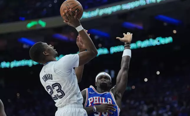 Memphis Grizzlies' Cedric Coward (23) goes up to shoot against Philadelphia 76ers' Adem Bona during the first half of an NBA basketball game, Tuesday, March 10, 2026, in Philadelphia. (AP Photo/Matt Rourke)