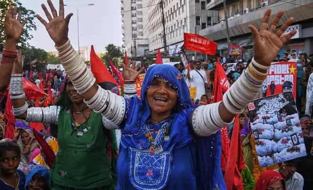Women's right activists take part in a rally to mark International Women's Day, in Karachi, Pakistan, Sunday, March 8, 2026. (AP Photo/Ali Raza)