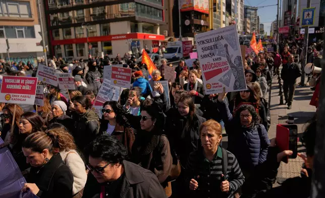 Women march during a protest marking the International Women's Day, in Istanbul, Turkey, Sunday, March 8, 2026. Placard reads in Turkish: "We fight against poverty, violence, and war!". (AP Photo/Khalil Hamra)