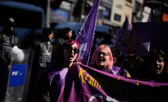 Women shout slogans as they march during a protest marking the International Women's Day, in Istanbul, Turkey, Sunday, March 8, 2026. (AP Photo/Khalil Hamra)