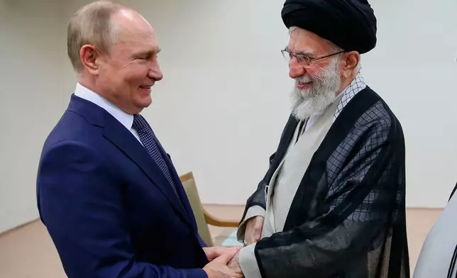 FILE - In this picture released by the official website of Iranian Supreme Leader Ayatollah Ali Khamenei, he and Russian President Vladimir Putin greet each other on July 19, 2022, during a meeting in Tehran, Iran. (Office of the Iranian Supreme Leader via AP, File)
