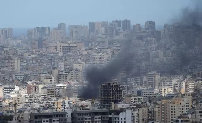 Smoke rises following an Israeli airstrike in Dahiyeh, Beirut's southern suburbs, Lebanon, Monday, March 30, 2026. (AP Photo/Bilal Hussein)