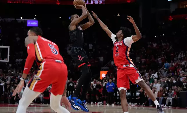 Houston Rockets forward Kevin Durant (7) shoots a 3-pointer against New Orleans Pelicans forward Herbert Jones (2) during the second half of an NBA basketball game in Houston, Friday, March 13, 2026. (AP Photo/Ashley Landis)