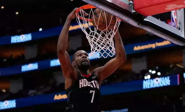 Houston Rockets forward Kevin Durant dunks during the second half of an NBA basketball game against the New Orleans Pelicans in Houston, Friday, March 13, 2026. (AP Photo/Ashley Landis)