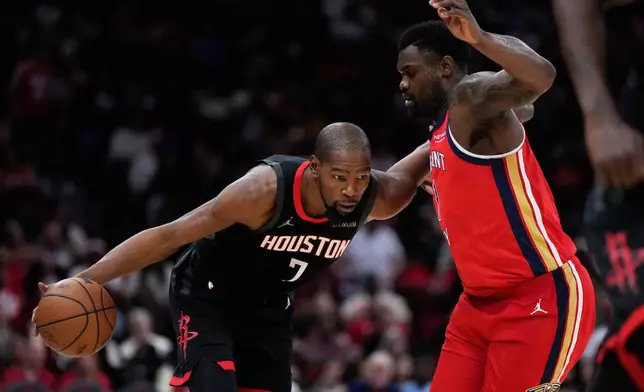 New Orleans Pelicans forward Zion Williamson (1) defends against Houston Rockets forward Kevin Durant (7) during the second half of an NBA basketball game in Houston, Friday, March 13, 2026. (AP Photo/Ashley Landis)