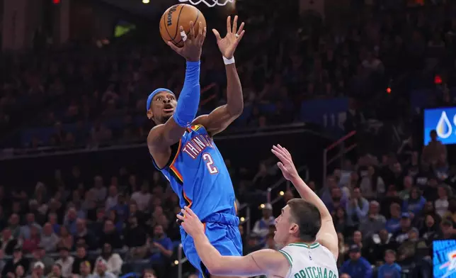 Oklahoma City Thunder guard Shai Gilgeous-Alexander (2) goes to the basket against Boston Celtics guard Payton Pritchard during the first half of an NBA basketball game, Thursday, March 12, 2026, in Oklahoma City. (AP Photo/Nate Billings)