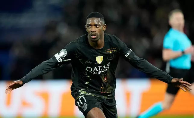 PSG's Ousmane Dembele celebrates after scoring his side's second goal during the first leg of the Champions League round of 16 soccer match between Paris Saint-Germain and Chelsea, in Paris, Wednesday, March 11, 2026. (AP Photo/Michel Euler)