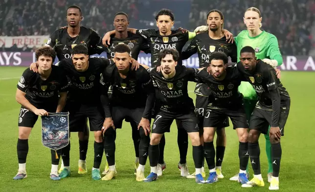 PSG players pose ahead of the first leg of the Champions League round of 16 soccer match between Paris Saint-Germain and Chelsea, in Paris, Wednesday, March 11, 2026. (AP Photo/Michel Euler)
