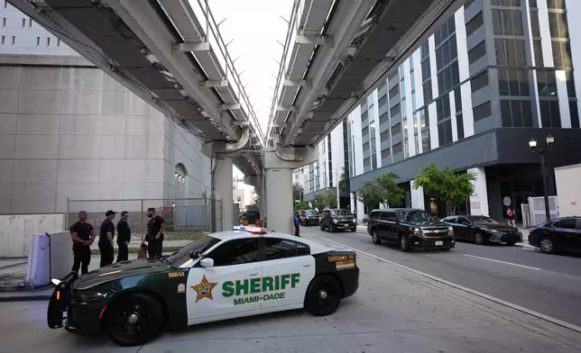 A convoy carrying Secretary of State Marco Rubio arrives at the James Lawrence King Federal Building where Rubio was set to testify in the trial of his former roommate David Rivera, Tuesday, March 24, 2026, in Miami. (AP Photo/Rebecca Blackwell)