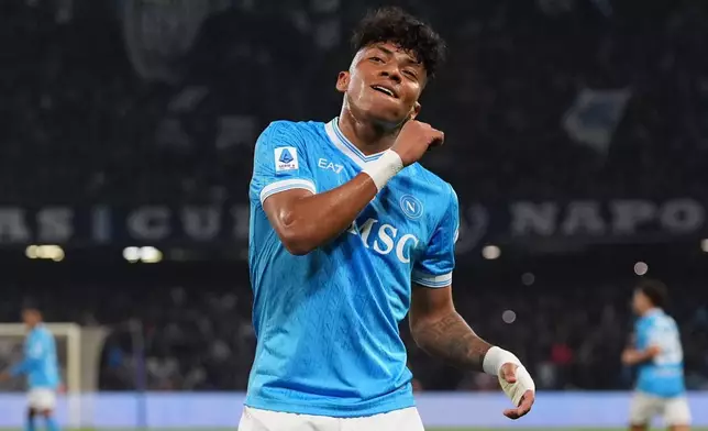 Napoli's Alisson Santos celebrates scoring during the Serie A soccer match between Napoli and Torino in Naples, Italy, Friday March 6, 2026. (Alfredo Falcone/LaPresse via AP)