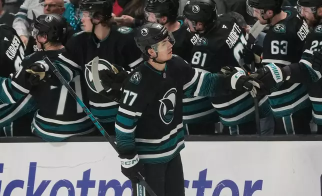 San Jose Sharks center Michael Misa (77) is congratulated by teammates after scoring against the Montréal Canadiens during the second period of an NHL hockey game in San Jose, Calif., Tuesday, March 3, 2026. (AP Photo/Jeff Chiu)