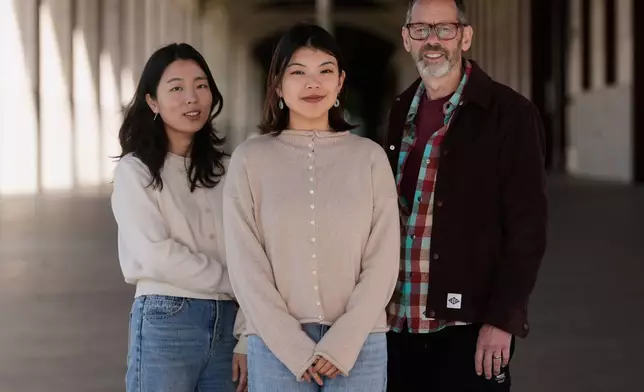 Cinoo Lee, Stanford postdoctoral fellow in psychology, from left, Myra Cheng, Stanford Ph.D. candidate in computer science, Stanford University, and Dan Jurafsky, Stanford professor of computer science and linguistics, pose for photos on the university campus in Stanford, Calif., Thursday, March 26, 2026. (AP Photo/Jeff Chiu)