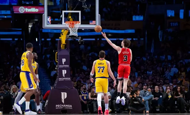 Chicago Bulls guard Josh Giddey (3) goes to the basket against the Los Angeles Lakers during the first half of an NBA basketball game, Thursday, March 12, 2026, in Los Angeles. (AP Photo/Ethan Swope)