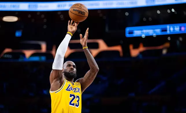 Los Angeles Lakers forward LeBron James shoots a free throw during the first half of an NBA basketball game against the Chicago Bulls, Thursday, March 12, 2026, in Los Angeles. (AP Photo/Ethan Swope)