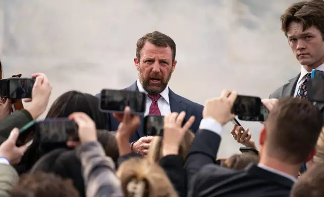 Sen. Markwayne Mullin, R-Okla., speaks to the press outside of the Capitol, Thursday, March 5, 2026, in Washington. (AP Photo/Allison Robbert)