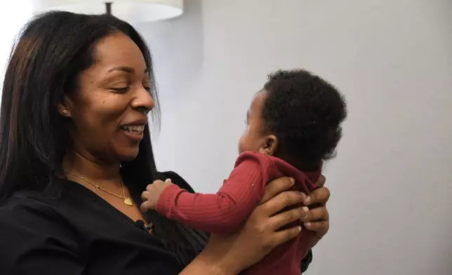 Shanille Bowens, a doula, smiles at Isaiah Stewart during an appointment on Feb. 28, 2026, in Memphis, Tenn. (AP Photo/Kristin M. Hall)