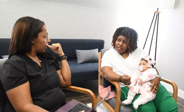 Doula Shanille Bowens speaks to Mary Bey during an appointment on Feb. 28, 2026, in Memphis, Tenn. (AP Photo/Kristin M. Hall)