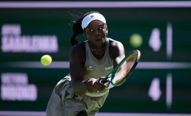 Victoria Mboko, of Canada, returns a shot against Aryna Sabalenka, of Belarus, during a quarterfinal match at the BNP Paribas Open tennis tournament, Thursday, March 12, 2026, in Indian Wells, Calif. (AP Photo/Mark J. Terrill)