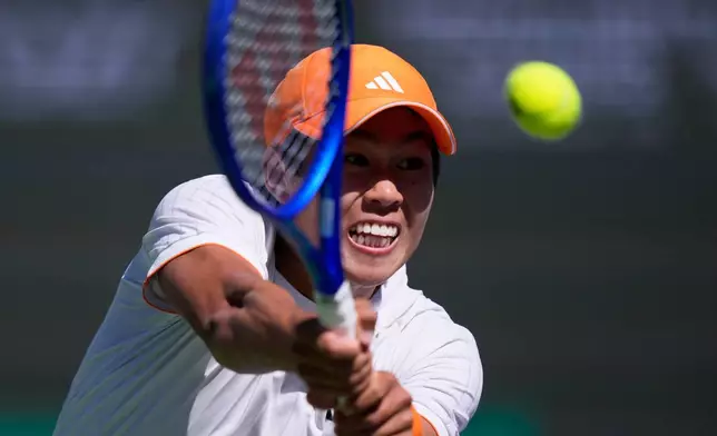 Learner Tien returns a shot against Jannik Sinner, of Italy, during a quarterfinal match at the BNP Paribas Open tennis tournament, Thursday, March 12, 2026, in Indian Wells, Calif. (AP Photo/Mark J. Terrill)