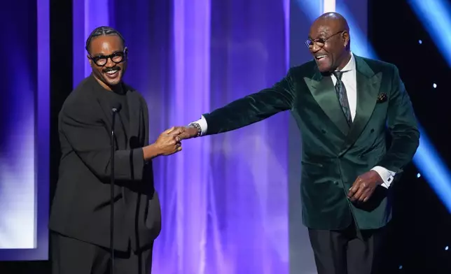 Ryan Coogler, left, and Delroy Lindo present the award for outstanding actress in a motion picture during the 57th NAACP Image Awards on Saturday, Feb. 28, 2026, in Pasadena, Calif. (AP Photo/Chris Pizzello)