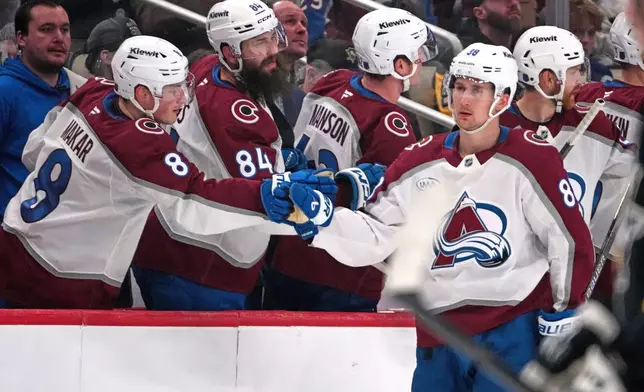 Colorado Avalanche's Martin Necas (88) returns to the bench after scoring during the second period of an NHL hockey game against the Pittsburgh Penguins in Pittsburgh, Tuesday, March 24, 2026. (AP Photo/Gene J. Puskar)
