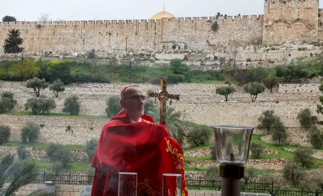 Cardinal Pierbattista Pizzaballa, the Latin Patriarch of Jerusalem, holds a prayer service to mark Palm Sunday in Jerusalem, Sunday, March 29, 2026. (Ammar Awad/Pool Photo via AP)