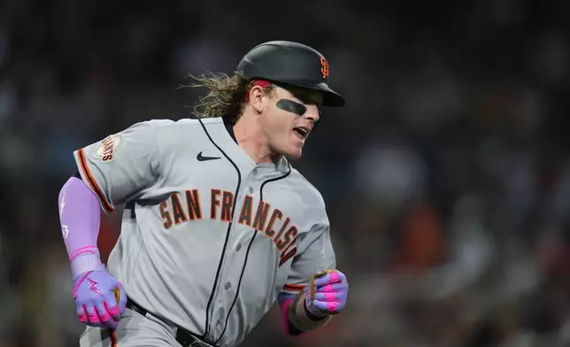 San Francisco Giants' Harrison Bader celebrates his home run during the third inning of a baseball game against the San Diego Padres Monday, March 30, 2026, in San Diego. (AP Photo/Gregory Bull)