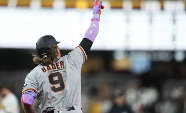 San Francisco Giants' Harrison Bader celebrates his home run during the third inning of a baseball game against the San Diego Padres Monday, March 30, 2026, in San Diego. (AP Photo/Gregory Bull)