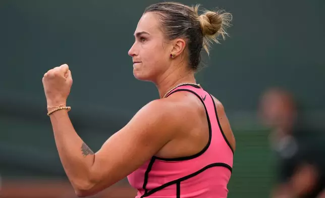 Aryna Sabalenka, of Belarus, reacts after winning a game against Linda Noskova, of the Czech Republic, during a semifinal match at the BNP Paribas Open tennis tournament, Friday, March 13, 2026, in Indian Wells, Calif. (AP Photo/Mark J. Terrill)