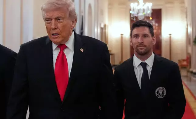 Lionel Messi arrives with President Donald Trump at an event to honor the 2025 Major League Soccer champions Inter Miami CF in the East Room of the White House, Thursday, March 5, 2026, in Washington. (AP Photo/Alex Brandon)