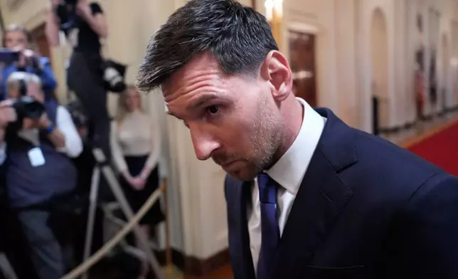 Lionel Messi arrives with President Donald Trump for an event to honor the 2025 Major League Soccer champions Inter Miami CF in the East Room of the White House, Thursday, March 5, 2026, in Washington. (AP Photo/Alex Brandon)