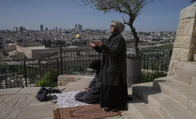 Palestinian women offer Friday Ramadan prayers in Jerusalem, as the Old City remains closed to visitors under nationwide Home Front Command restrictions banning large gatherings amid the war with Iran, Friday, March 6, 2026. (AP Photo/Mahmoud Illean)