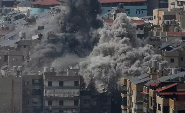 Smoke rises following an Israeli airstrike in Dahiyeh, Beirut's southern suburbs, Friday, March 6, 2026. (AP Photo/Hussein Malla)