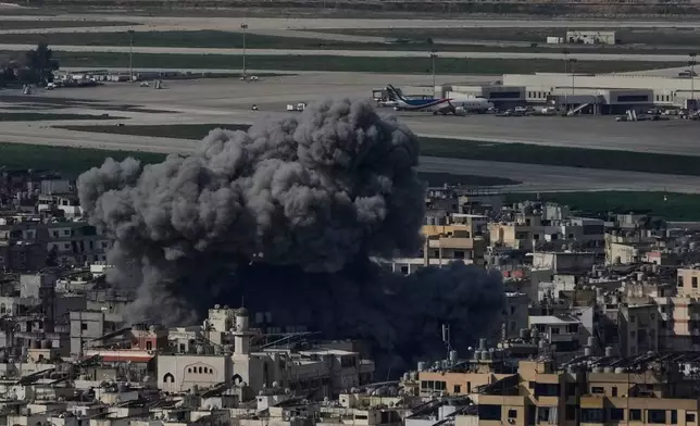 Smoke rises following an Israeli airstrike in Dahiyeh, Beirut's southern suburb, near Rafik Hariri International Airport, Lebanon, Wednesday, March 4, 2026. (AP Photo/Bilal Hussein)