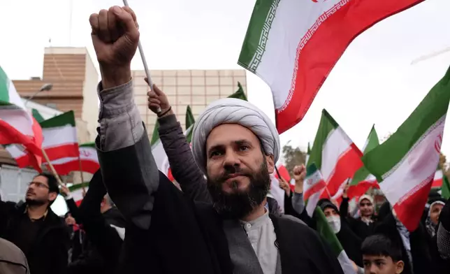 A cleric chants slogan in a demonstration in support of the government and against U.S. and Israeli strikes in Tehran, Iran, Saturday, Feb. 28, 2026. (AP Photo/Vahid Salemi)