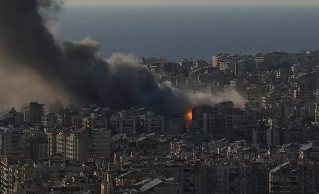 Flames and smoke rise following Israeli airstrikes on Dahiyeh, a southern suburb of Beirut, Lebanon, Monday, March 2, 2026. (AP Photo/Hassan Ammar)