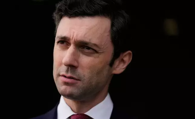 FILE - Sen. Jon Ossoff, D-Ga., listens during an interview at Dobbins Air Reserve Base, April 26, 2025, in Marietta, Ga. (AP Photo/Brynn Anderson, File)