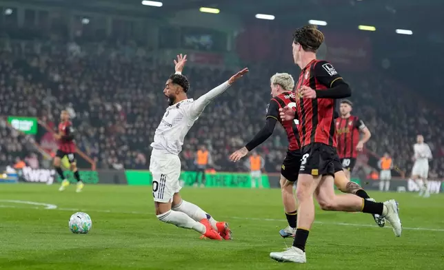 Manchester United's Matheus Cunha is fouled in the box by Bournemouth's Alex Jimenez during an Premier League soccer match against AFC Bournemouth, Friday, March 20, 2026, in Bournemouth, England. (Andrew Matthews/PA via AP)